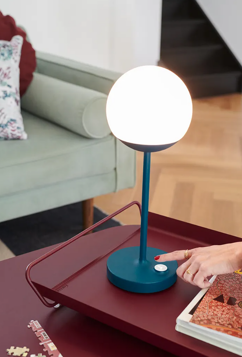 Load image into Gallery viewer, Fermob MOOON! wireless table lamp with moon design, outdoor use, compact size, and warm glowing light.