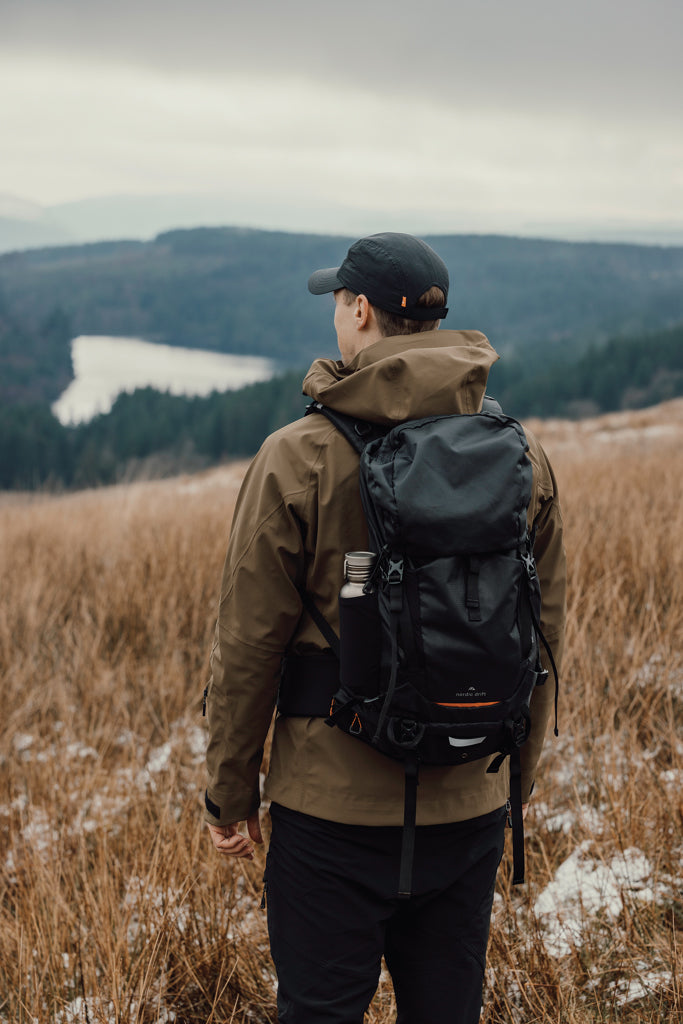 Load image into Gallery viewer, Nordic Drift Trail RCS 33L backpack with multiple compartments and padded straps, designed for travel and outdoor adventures.