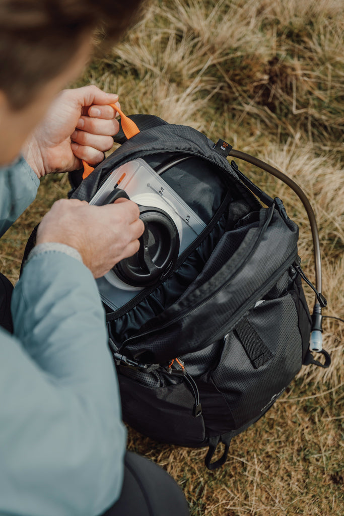 Load image into Gallery viewer, Nordic Drift Trail RCS 24L backpack with multiple compartments and adjustable straps, designed for travel and outdoor use.