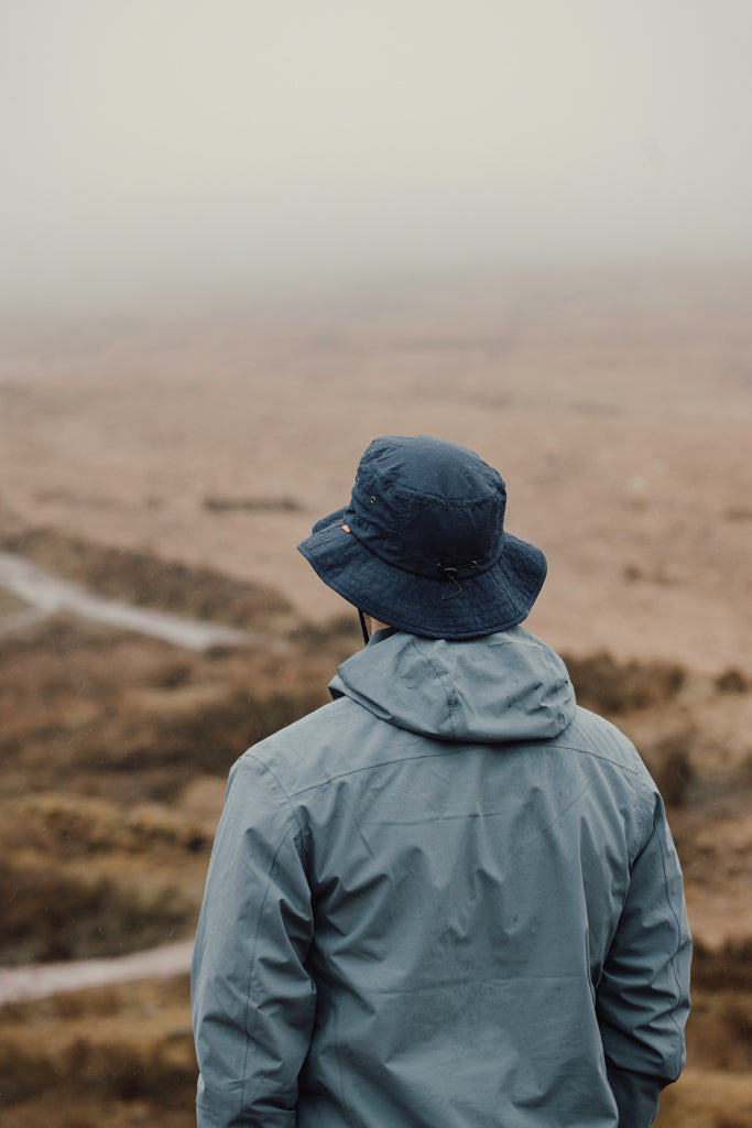 Load image into Gallery viewer, Nordic Drift RCS Horizon UPF 50+ bucket hat, light-colored headwear with wide brim, designed for sun protection and outdoor wear.