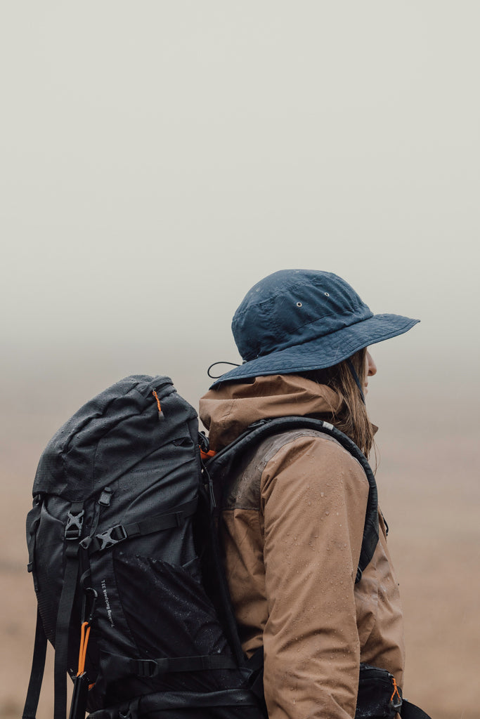 Load image into Gallery viewer, Nordic Drift RCS Horizon UPF 50+ bucket hat in neutral color, lightweight headwear with wide brim for sun protection.