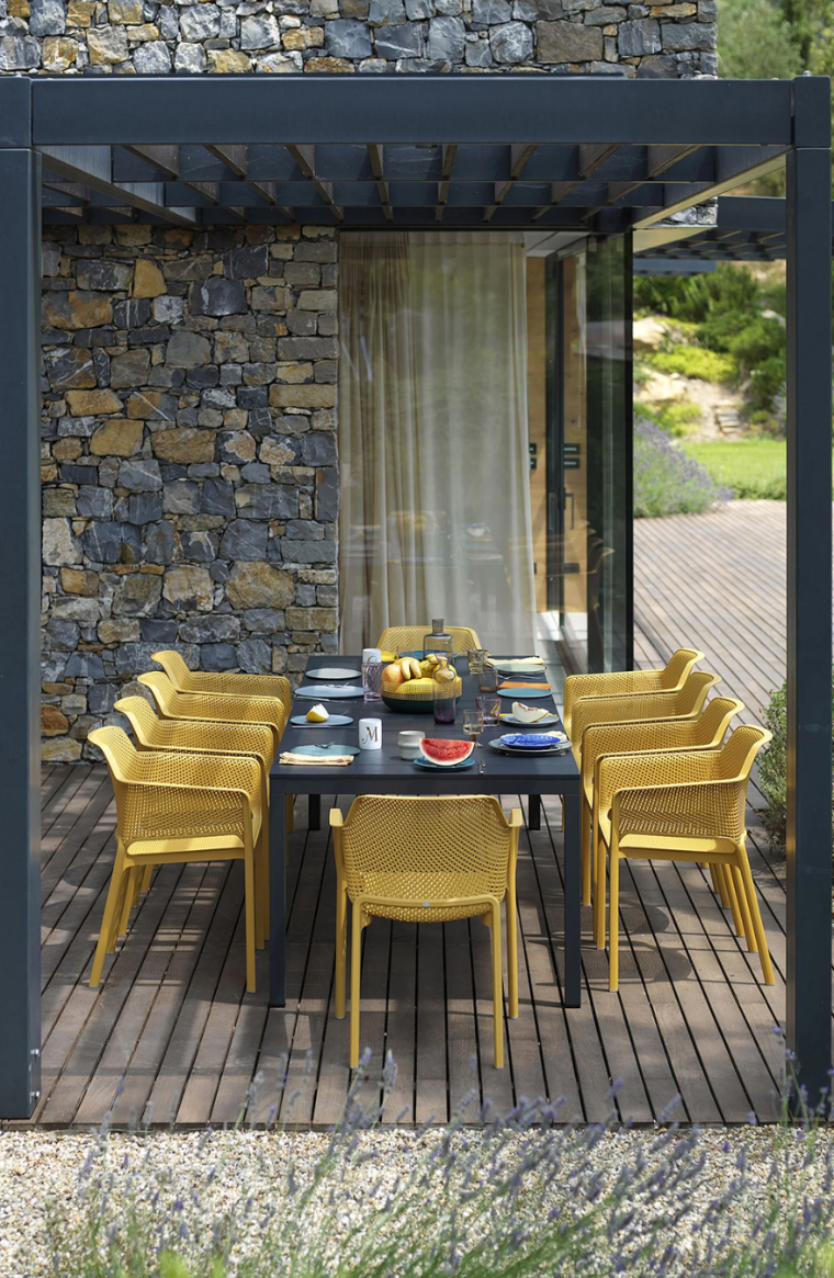 Load image into Gallery viewer, Nardi Net outdoor chair with a woven gray seat and armrests, set on a patio for stylish outdoor relaxation.