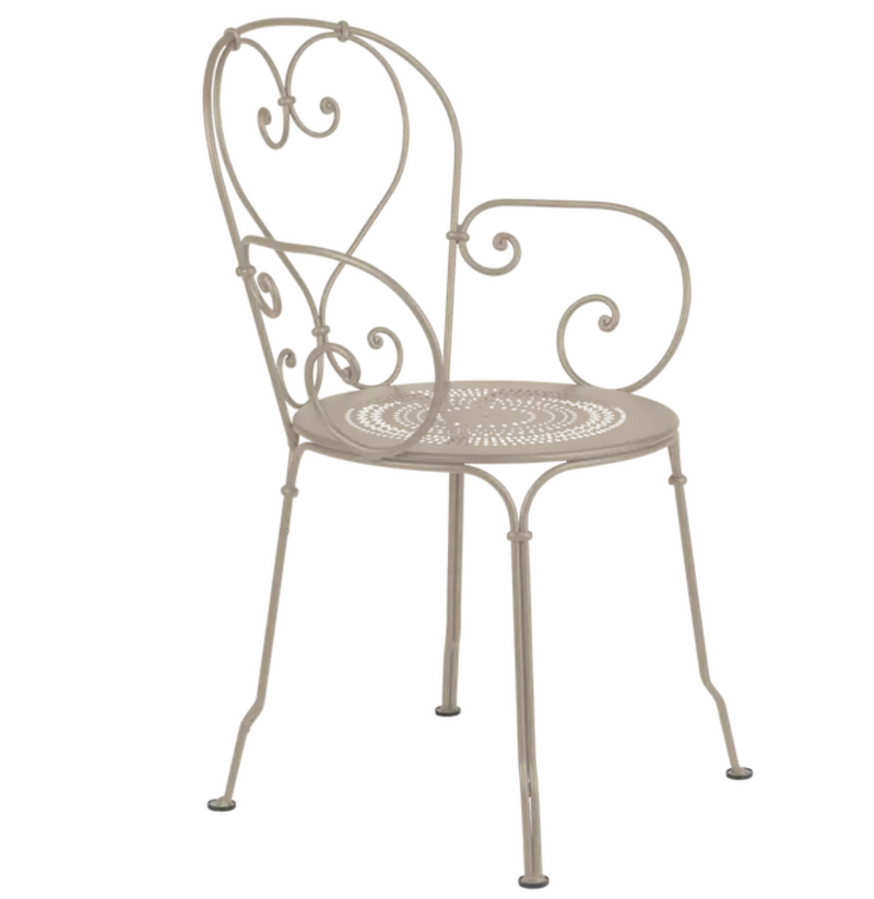 Load image into Gallery viewer, Nutmeg Fermob 1900 lounge armchair with a stylish, curved design suitable for outdoor patio or indoor relaxation spaces.