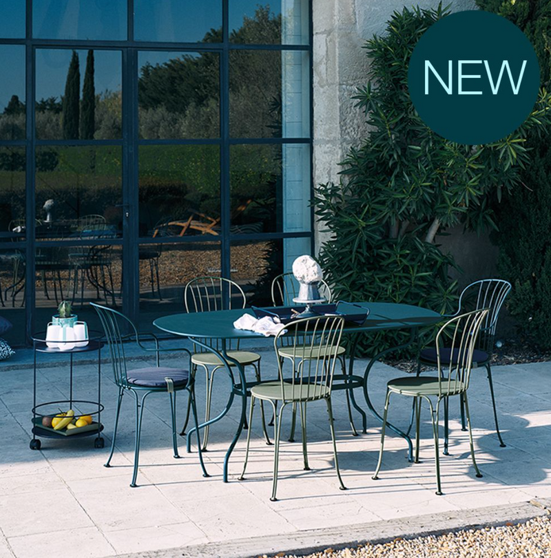 Load image into Gallery viewer, Fermob OPÉRA+ outdoor metal chair with a sleek design, featuring a curved backrest and armrests, ideal for patio seating.