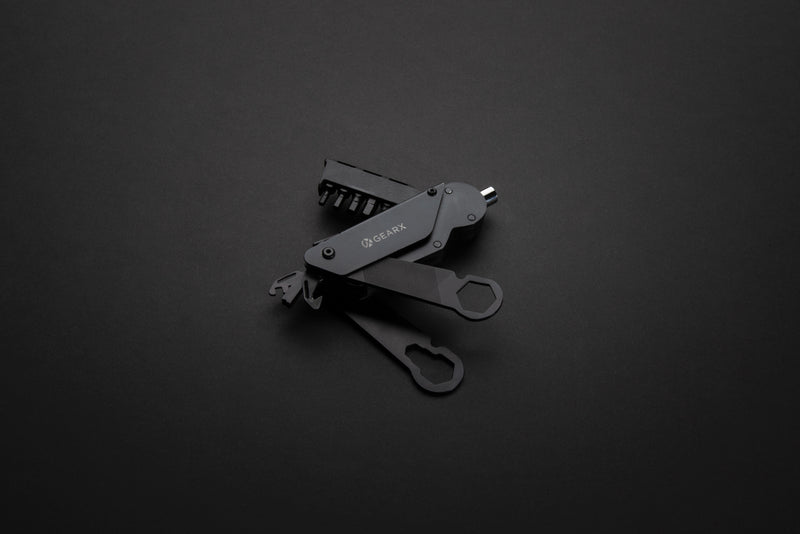 Load image into Gallery viewer, GearX bicycle tool from Tools & Torches collection, showing compact multi-tool with various wrenches and screwdrivers for bike repairs.
