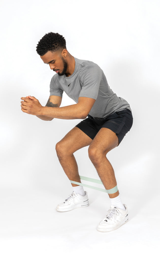 Load image into Gallery viewer, Set of four elastic fitness bands in a pouch by XD Collection, ideal for exercise and strength training routines.