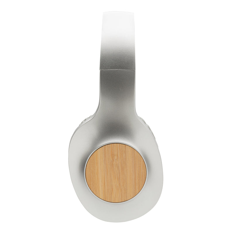 Load image into Gallery viewer, Wireless Dakota Bamboo headphones by XD Xclusive with bamboo ear cups and built-in audio controls, shown from a side angle.