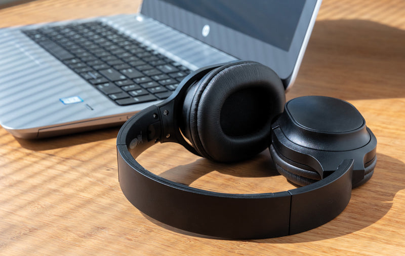 Load image into Gallery viewer, Recycled plastic XD Collection Elite foldable wireless headphones in black, showing the over-ear design and adjustable headband.