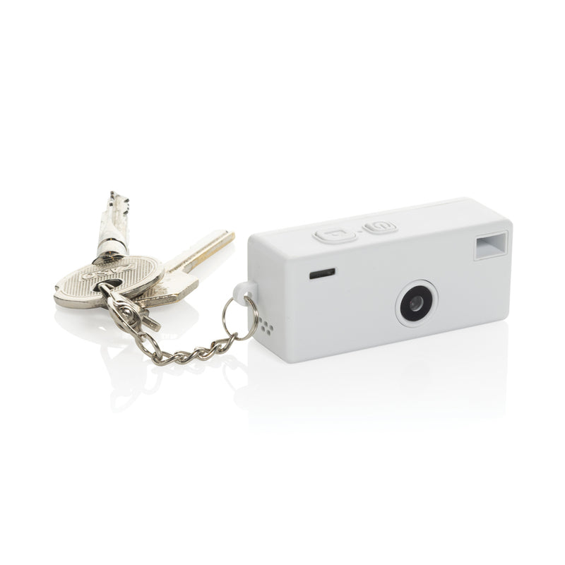 Load image into Gallery viewer, XD Xclusive Cliq it RCS recycled keychain camera attached to a phone, showing its compact design and eco-friendly materials.