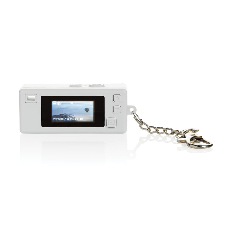 Load image into Gallery viewer, XD Xclusive Cliq it RCS recycled Keychain Camera attached to a phone, showcasing its compact design and eco-friendly material.