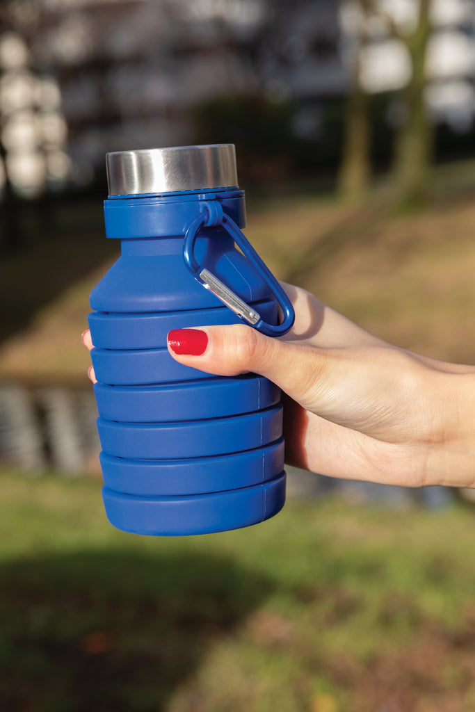 Load image into Gallery viewer, Leakproof collapsible silicone drinkware bottle with lid from XD Collection, showing the flexible, portable design and vibrant color.