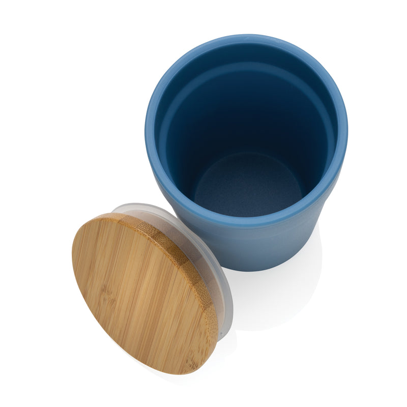 Load image into Gallery viewer, Reusable GRS certified recycled PP mug with bamboo lid from XD Collection, showing the eco-friendly drinkware with lid and handle.