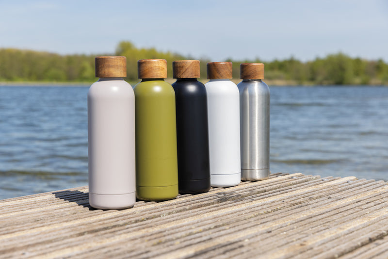 Load image into Gallery viewer, Recycled stainless steel vacuum bottle from XD Collection, eco-friendly drinkware with sleek design and spill-proof lid.