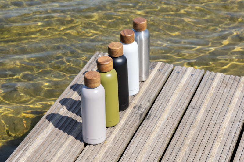 Load image into Gallery viewer, XD Collection recycled stainless steel vacuum bottle, eco-friendly drinkware with RCS certification, shown in a sleek design.