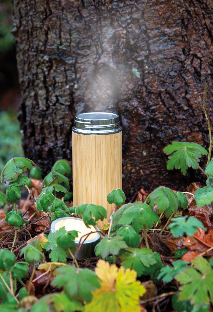 Load image into Gallery viewer, Leak-proof bamboo vacuum bottle from XD Collection, showcasing eco-friendly drinkware with a bamboo exterior and stainless steel interior.