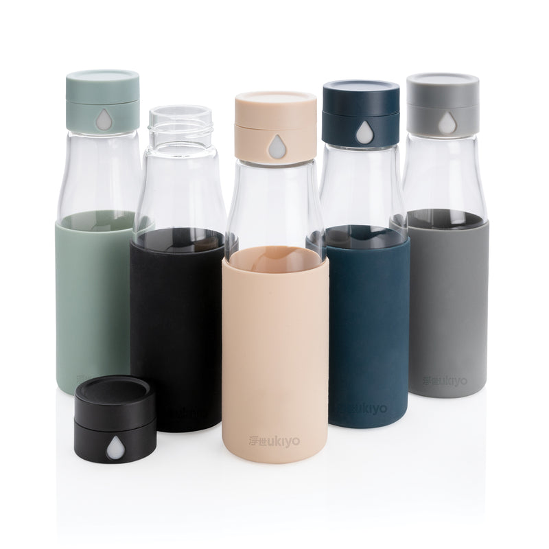 Load image into Gallery viewer, Ukiyo glass hydration tracking bottle with sleeve, clear drinkware with measurement markings and protective sleeve.