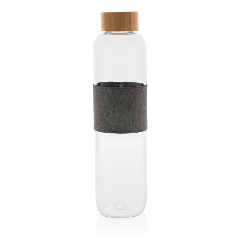 Load image into Gallery viewer, Borosilicate glass bottle with bamboo lid from XD Collection for drinking, featuring a sleek, clear glass design with a natural bamboo top.