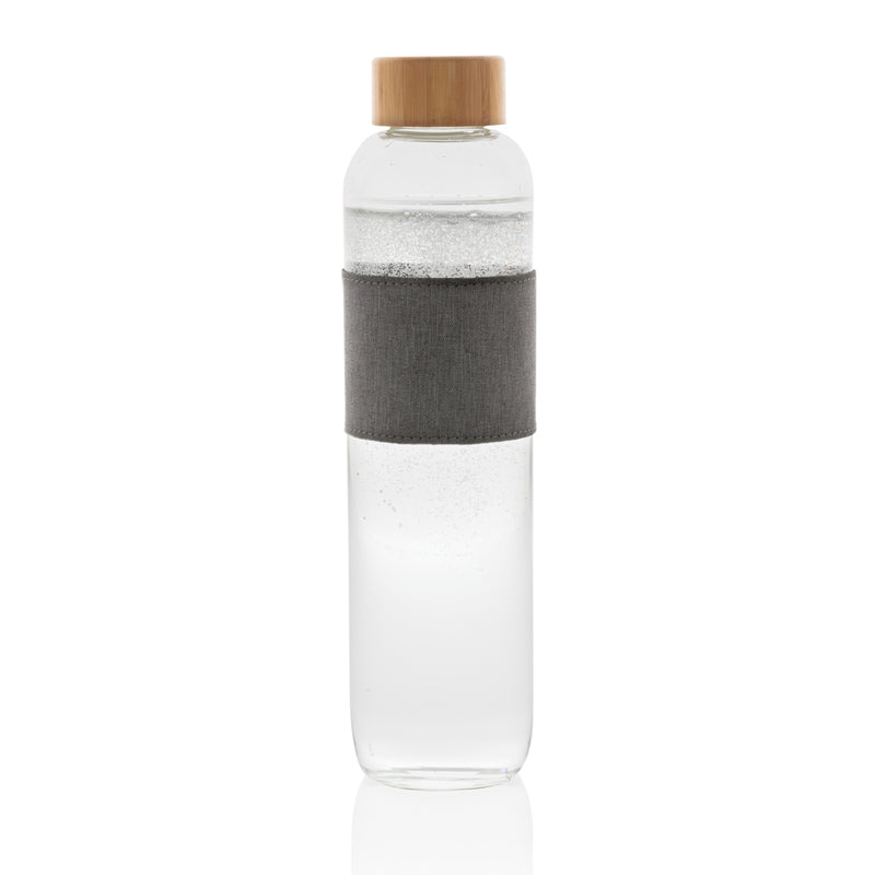 Load image into Gallery viewer, Borosilicate glass bottle with bamboo lid, XD Collection drinkware, featuring clear glass and natural bamboo closure.