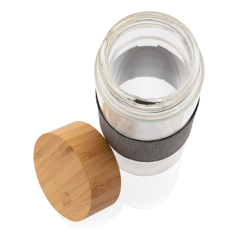 Load image into Gallery viewer, Borosilicate glass bottle with bamboo lid from XD Collection, showcasing a sleek, clear drinkware design with eco-friendly lid