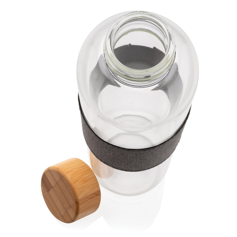 Load image into Gallery viewer, Borosilicate glass drinkware bottle with bamboo lid, featuring a sleek transparent design and natural bamboo top.