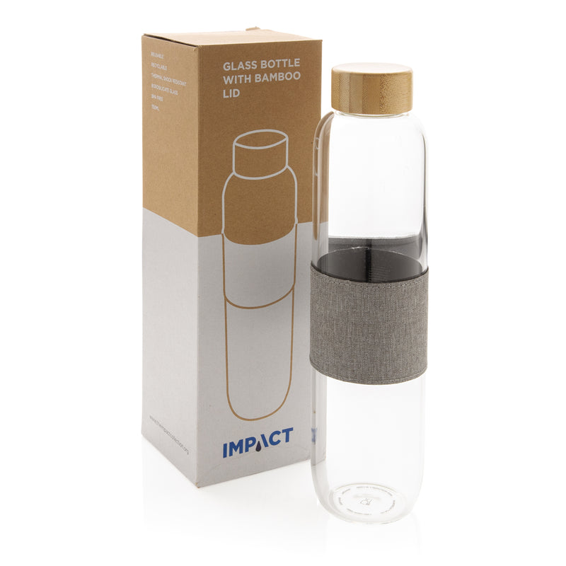 Load image into Gallery viewer, Borosilicate glass bottle with bamboo lid from XD Collection, showcasing a clear glass drinkware container with a wooden lid.