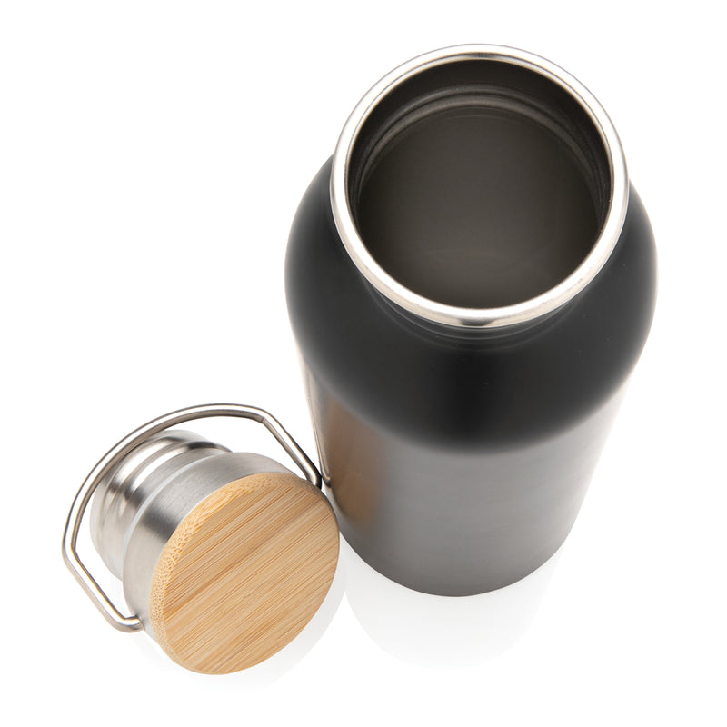 Load image into Gallery viewer, Modern stainless steel drinkware bottle with bamboo lid from XD Collection, featuring a sleek design and eco-friendly bamboo cap.