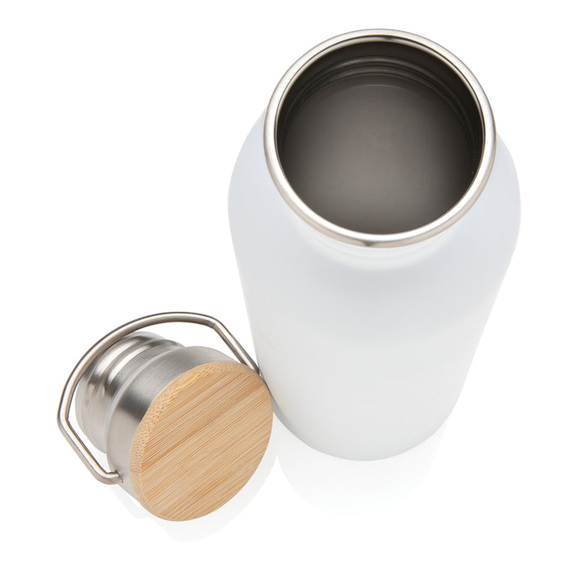 Load image into Gallery viewer, Modern stainless steel drinkware bottle with bamboo lid from XD Collection, featuring a sleek design and eco-friendly bamboo cap.