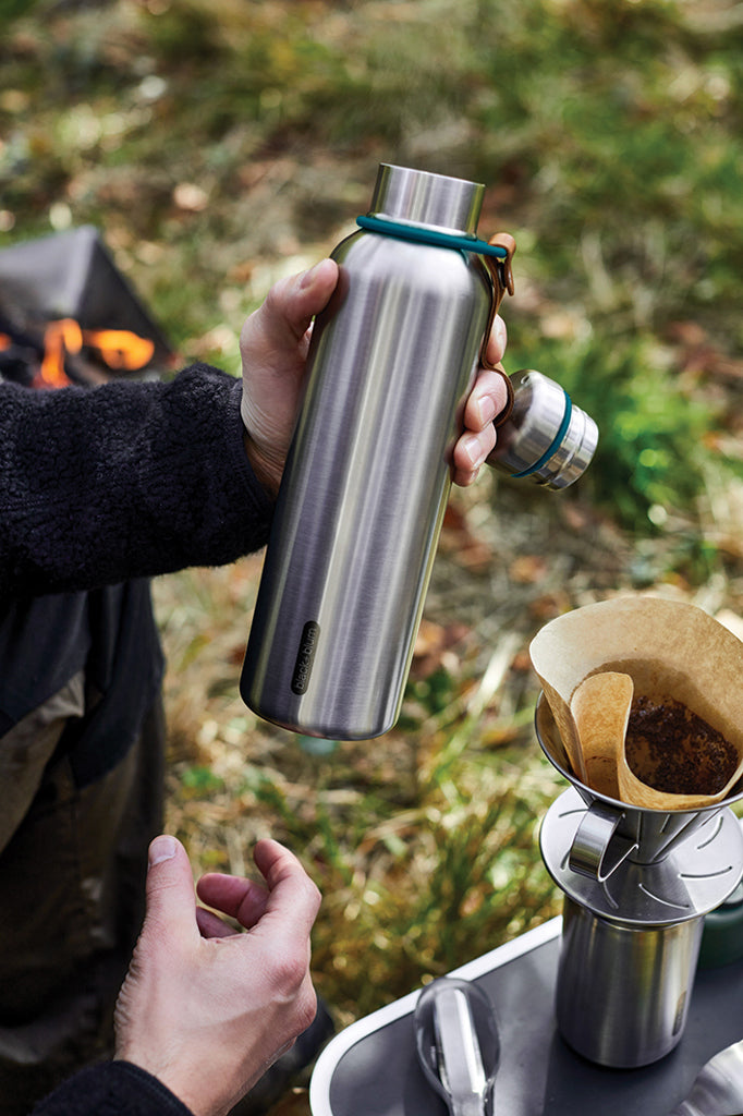 Load image into Gallery viewer, Large 750ml insulated water bottle by Black + Blum, stainless steel drinkware with a sleek design and secure lid.