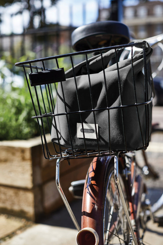 Load image into Gallery viewer, Black + Blum black insulated outdoor lunch and cooler bag with 6.7L capacity, featuring a zipper closure and carrying handle.