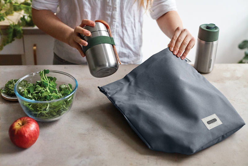 Load image into Gallery viewer, Black + Blum 6.7L insulated outdoor lunch cooler bag with black exterior and carrying handle, designed for keeping food fresh.