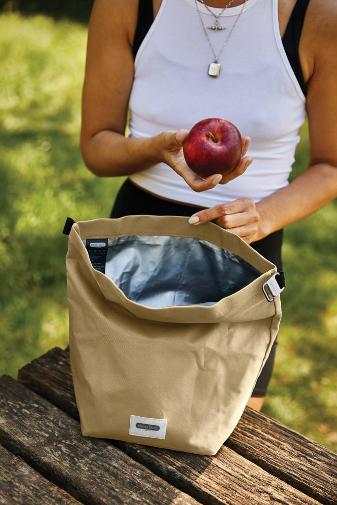 Load image into Gallery viewer, Black+Blum 6.7L insulated outdoor lunch cooler bag with black exterior and adjustable shoulder strap.