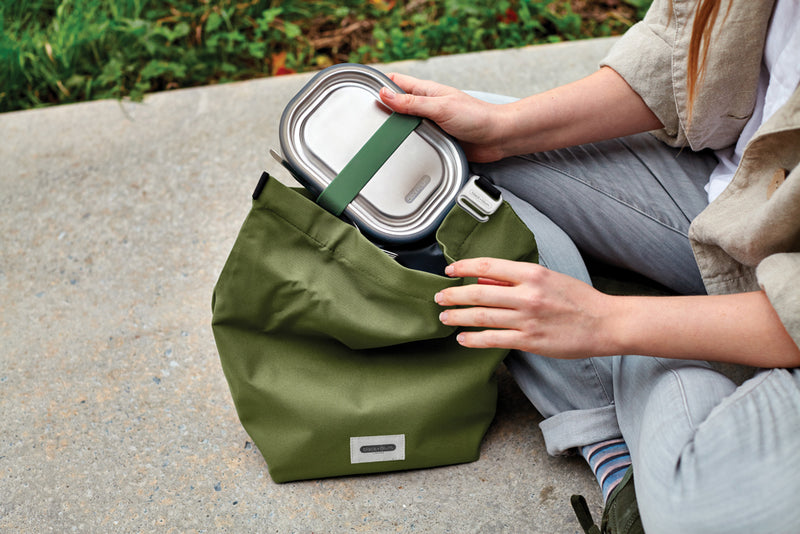 Load image into Gallery viewer, Black+Blum insulated outdoor Lunch/Cooler Bag in black, showing its spacious 6.7L interior with sturdy handle and zipper closure.
