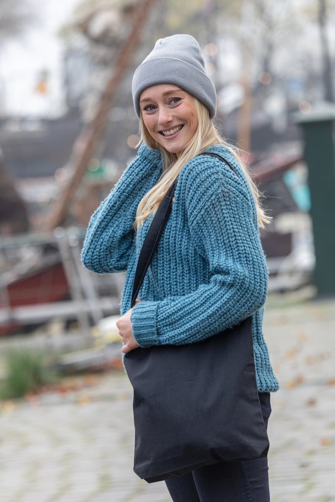 Load image into Gallery viewer, XD Collection Polylana® beanie headwear in charcoal gray, soft knit with folded brim and subtle branding detail.