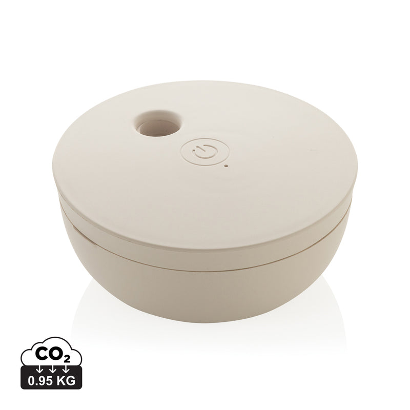 Load image into Gallery viewer, XD Collection Breevia RCS rechargeable floating humidifier for home and living, shown in use with water and mist.