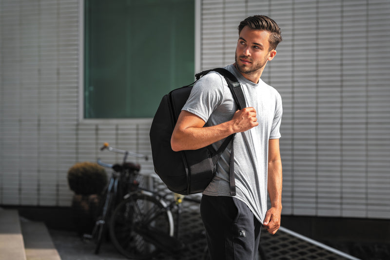 Load image into Gallery viewer, XD Design Flex Gym bag in black with multiple compartments, designed for travel and fitness gear storage.