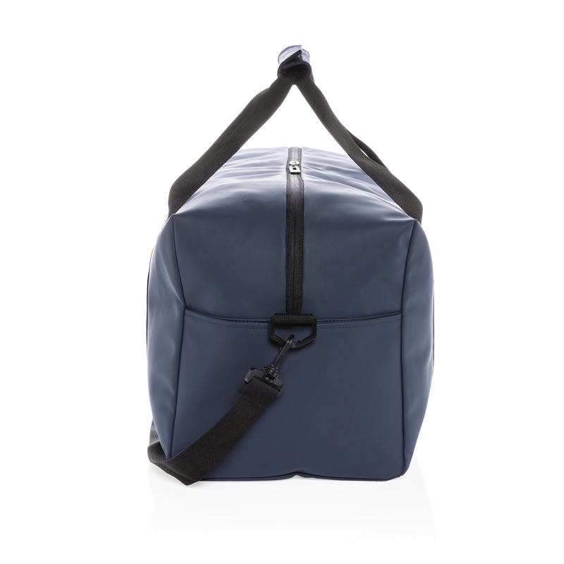 Load image into Gallery viewer, Smooth PU weekend duffle bag by XD Collection, showing its sleek design and sturdy handles in a natural travel setting.