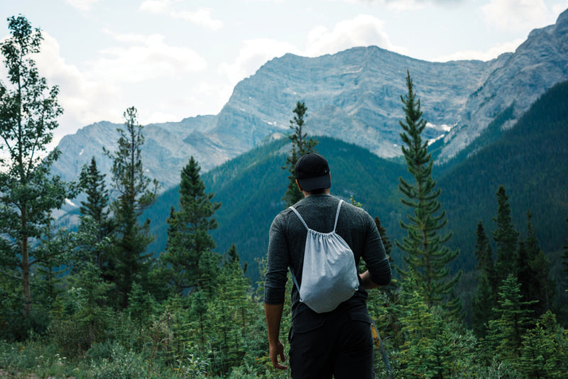 Load image into Gallery viewer, Recycled cotton drawstring backpack by XD Collection, Impact AWARE™ bag in 145g weight, shown with drawstrings and eco-friendly design.