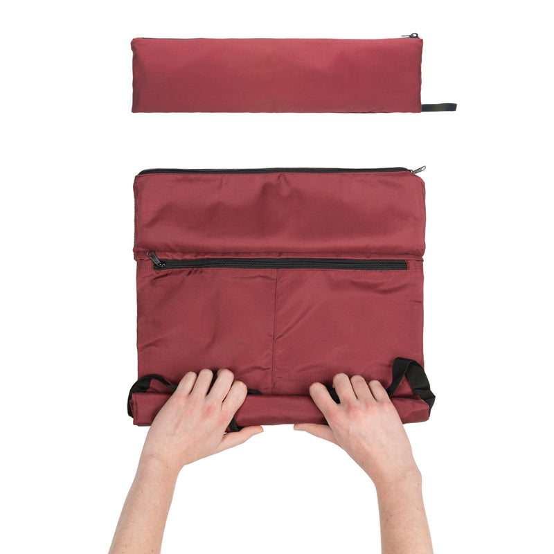 Load image into Gallery viewer, Lightweight foldable Dillon AWARE™ RPET backpack by XD Collection, shown folded and partially unfolded, in vibrant colors.