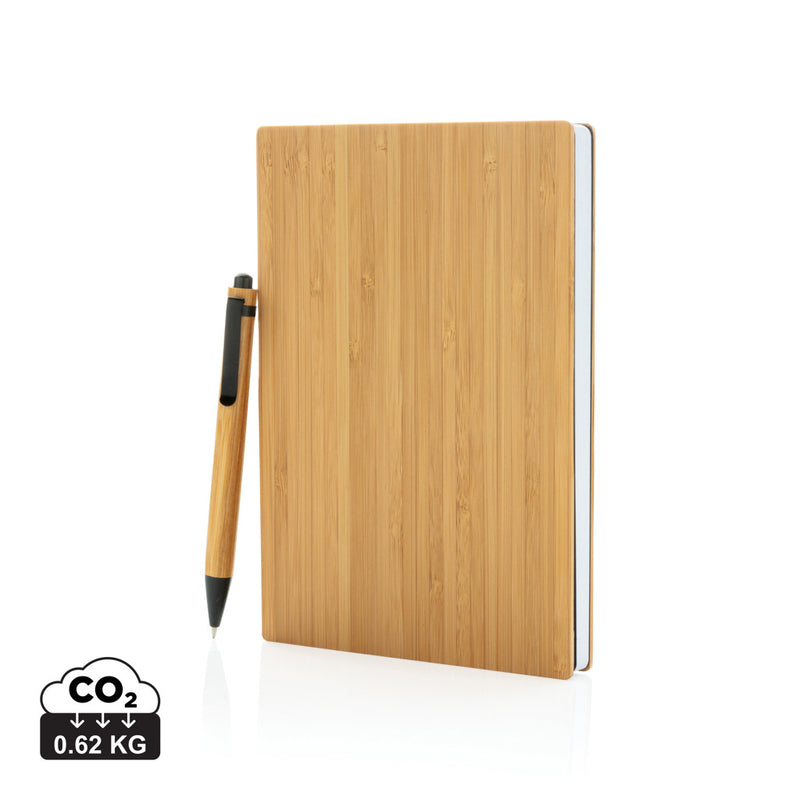 Load image into Gallery viewer, A5 bamboo notebook and pen set from XD Collection, featuring a sleek eco-friendly notebook with matching pen on a wooden surface.