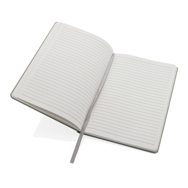 Load image into Gallery viewer, A5 Impact stone paper hardcover notebook by XD Collection, featuring a sleek black cover and visible elastic closure.