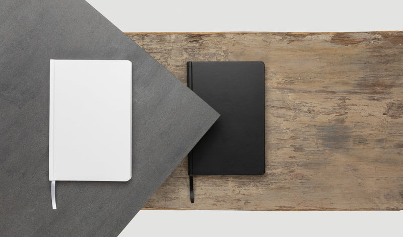 Load image into Gallery viewer, A5 Impact stone paper hardcover notebook by XD Collection with blank pages and a sleek black cover, perfect for note-taking.
