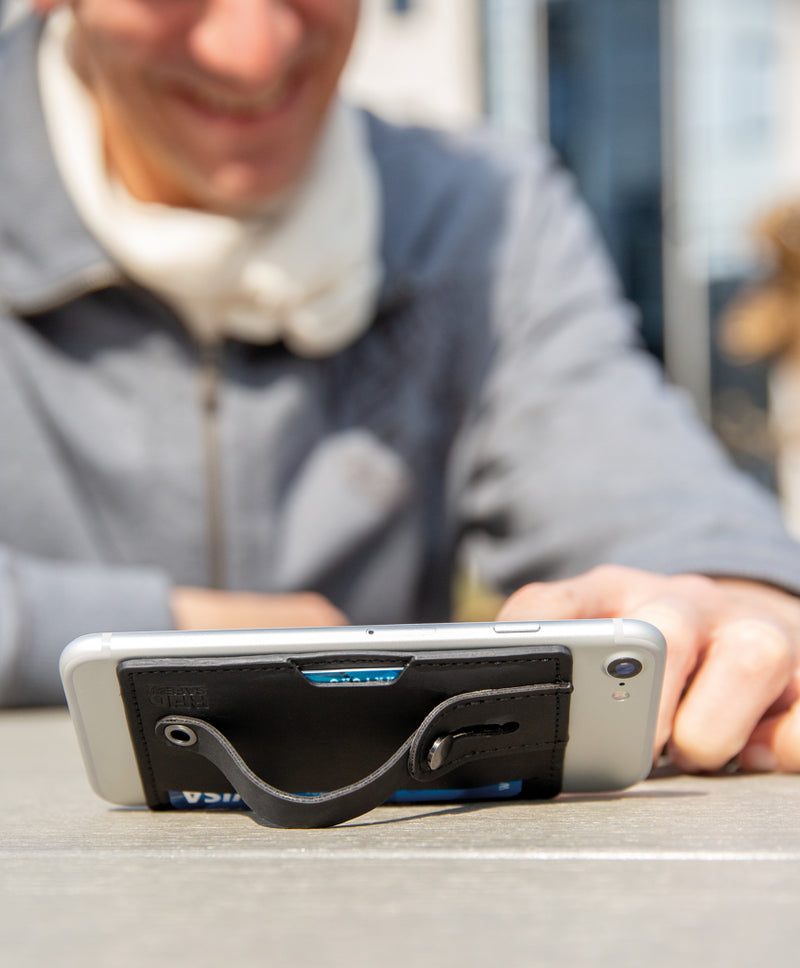 Load image into Gallery viewer, XD Collection 3-in-1 Phone Card Holder RFID accessory attached to a smartphone, with slots for cards and RFID protection.
