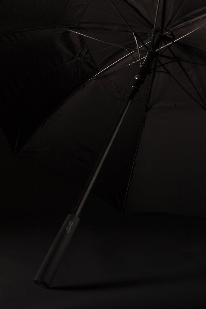 Load image into Gallery viewer, Swiss Peak Tornado 23-inch storm umbrella open, showing sturdy black canopy and ergonomic handle for heavy rain protection.
