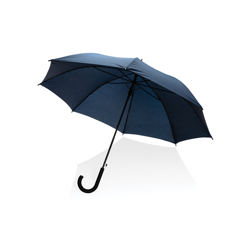 Load image into Gallery viewer, 23-inch Impact AWARE™ RPET auto open umbrella by XD Collection with navy canopy and auto-open mechanism in a natural outdoor setting.