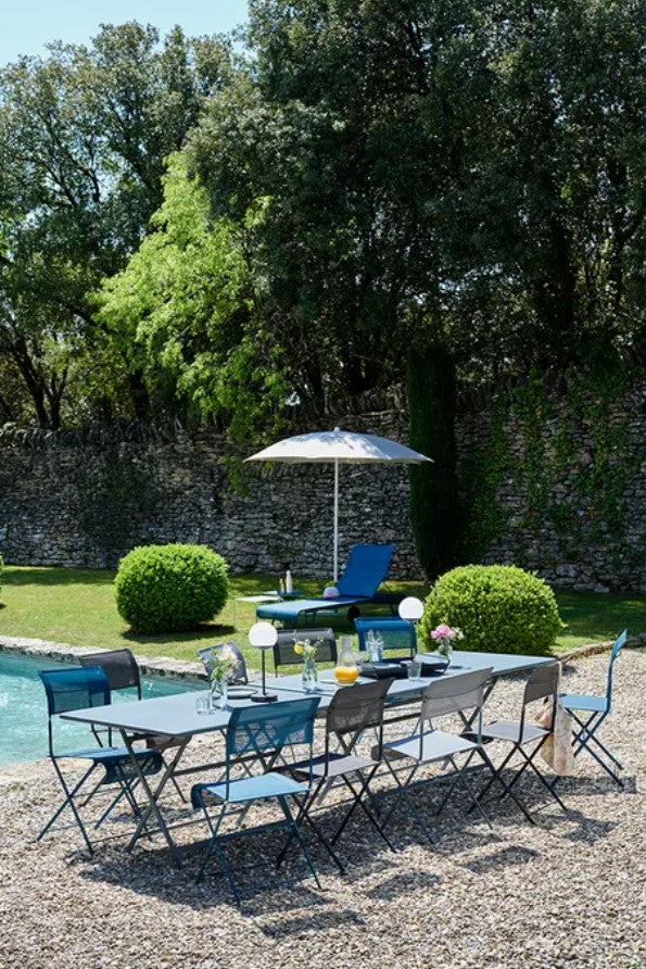 Load image into Gallery viewer, Fermob Shadoo outdoor parasol with 250cm diameter, providing shade for outdoor tables and hospitality settings.