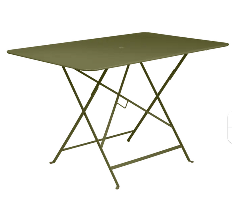 Load image into Gallery viewer, Fermob Pesto foldable bistro table measuring 117 x 77 cm with metal outdoor design, shown in a natural outdoor setting.