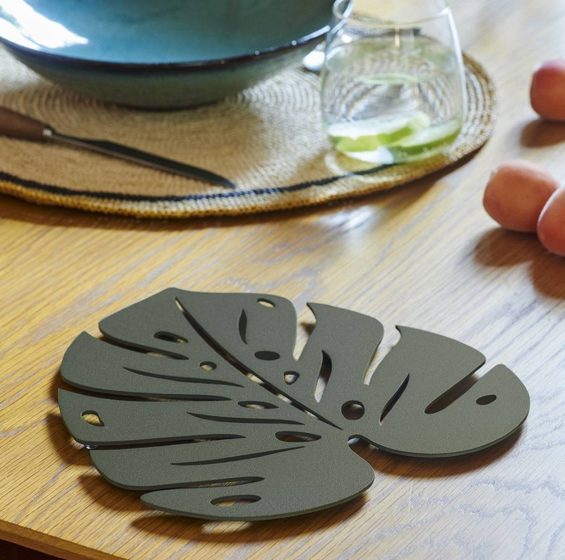 Load image into Gallery viewer, Fermob Bouquet Sauvage Monstera non-slip metal pad with green tropical leaf design for table stability.