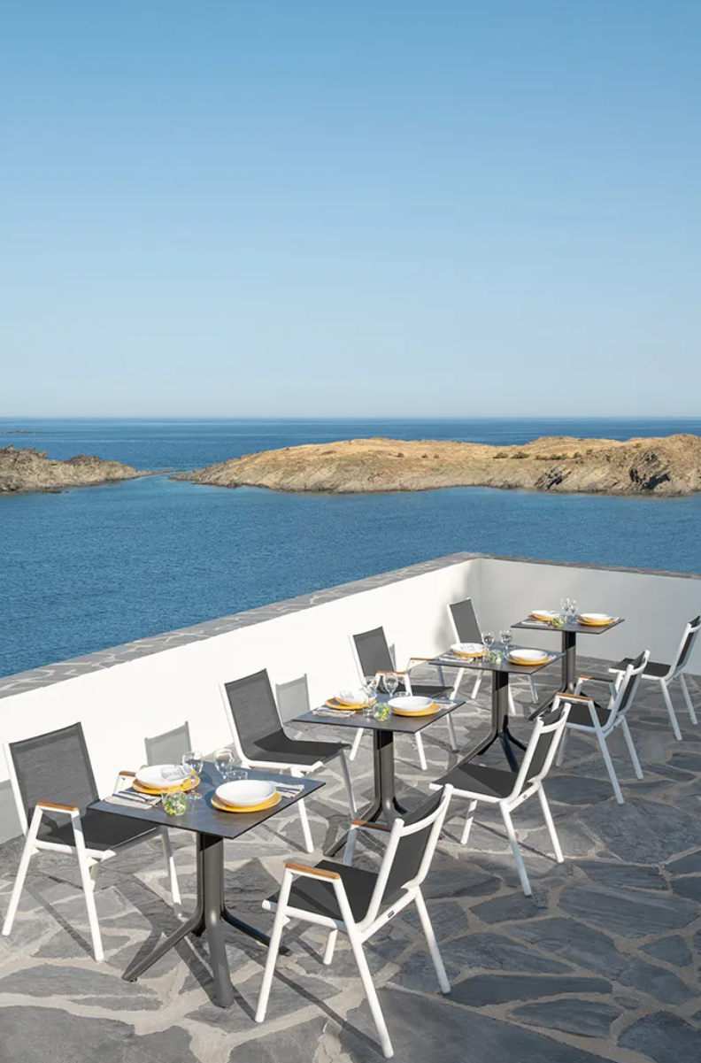 Load image into Gallery viewer, Fermob Pilotis V Batyline teak armchair with woven Batyline fabric, designed for outdoor restaurant or hotel seating.