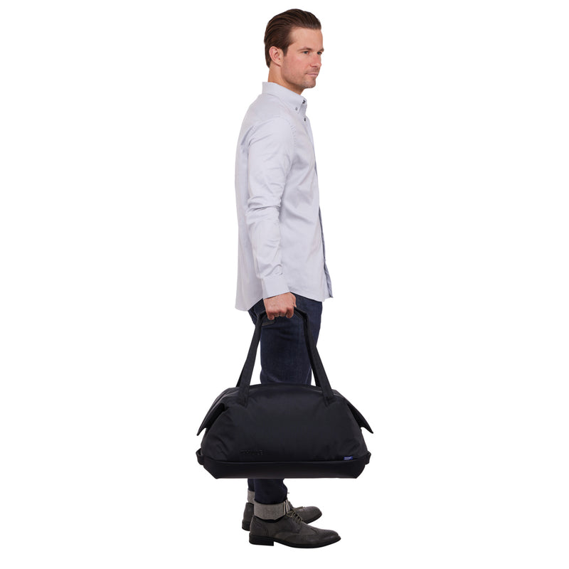 Load image into Gallery viewer, Thule Subterra 2 Duffel bag in black with a zippered main compartment and carry handles, designed for travel and storage.