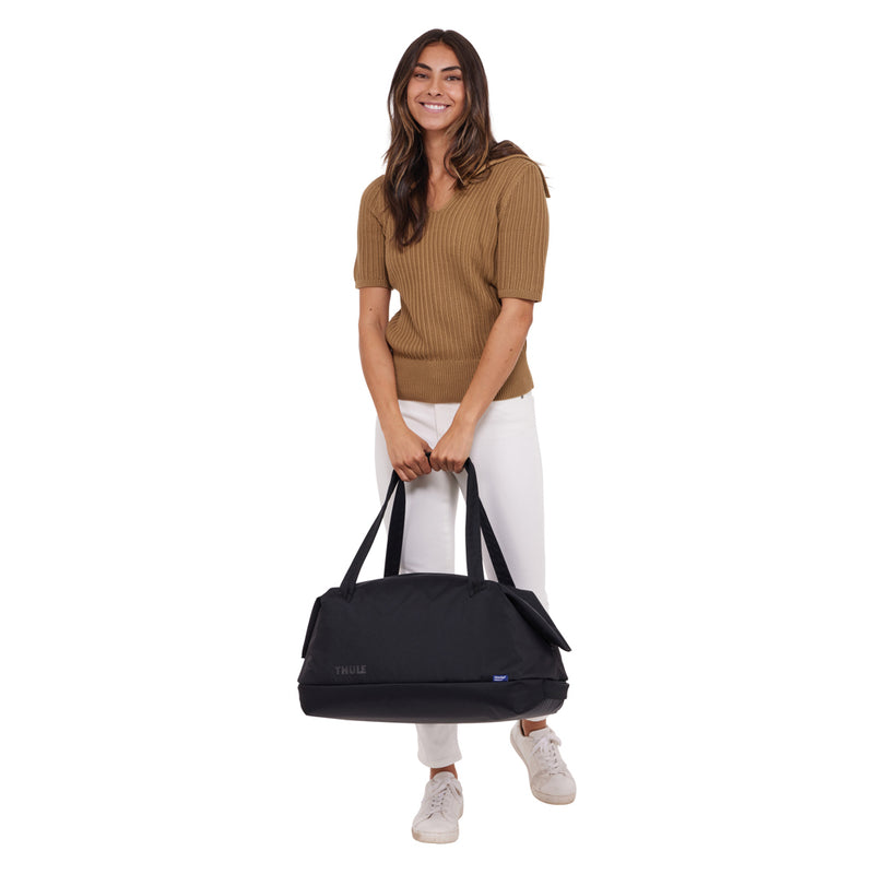 Load image into Gallery viewer, Thule Subterra 2 Duffel 35L bag in black with shoulder strap and zippered compartments, designed for travel and storage.